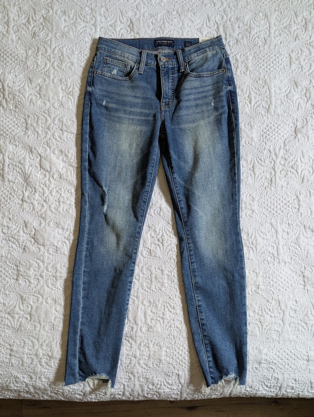 Lucky Brand Mid-Blue Skinny Jeans with Subtle Distressing